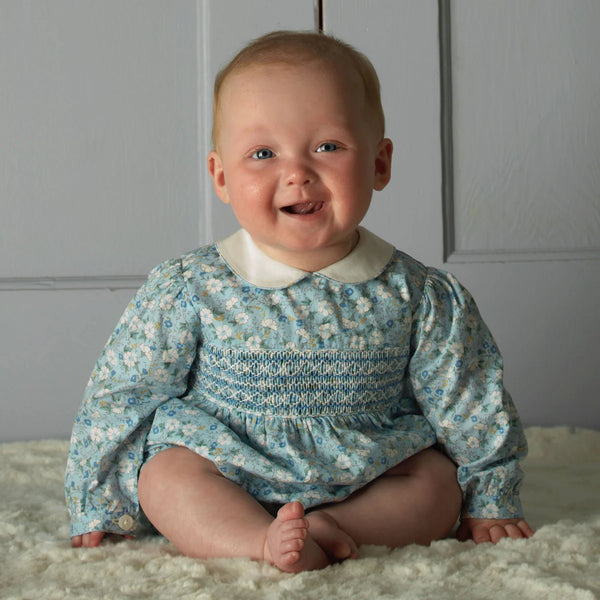 BLUE FLORAL SMOCKED BABYSUIT